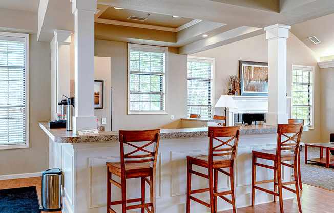 a living room with a bar and a piano