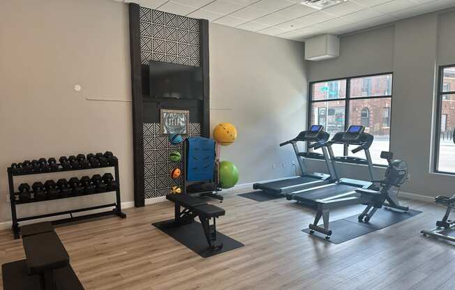 a fitness center with treadmills and other exercise equipment in a building