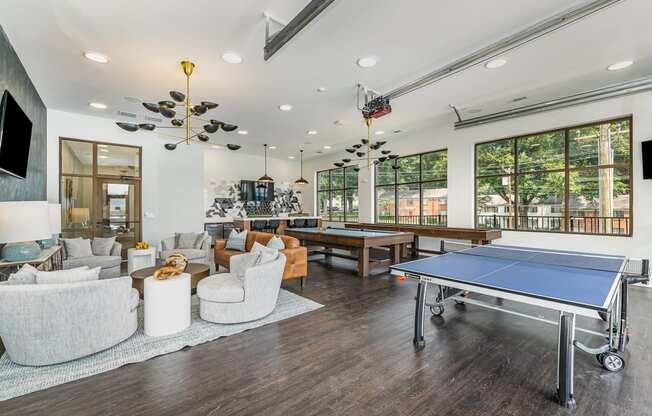 a games room with a ping pong table and a foosball table