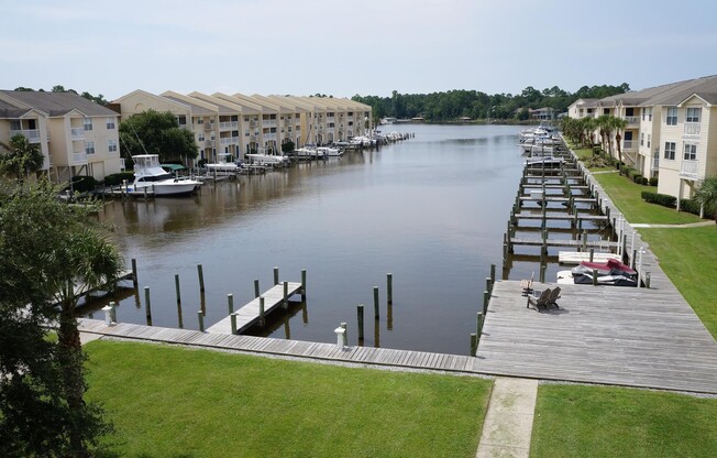 WATERFRONT LIVING!  BEAUTIFULLY APPOINTED CONDO ON SIMMONS BAYOU IN OS SCHOOL DIST - FULLY FURNISHED