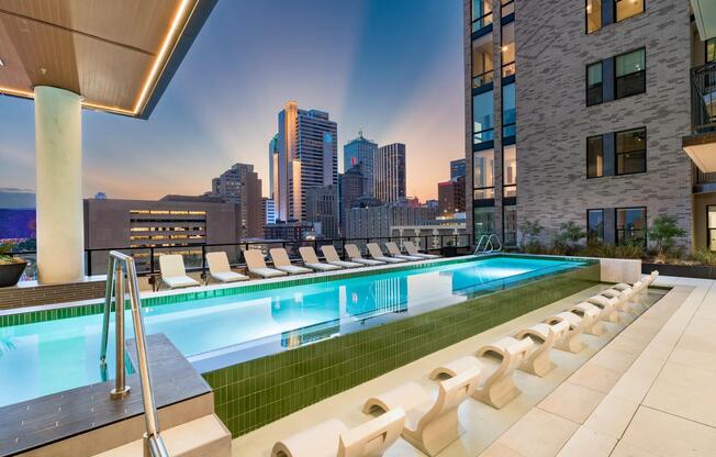 Take in dazzling Dallas skyline views from the resort-style pool at Modera St. Paul, the perfect retreat for sun-soaked relaxation or evening swims.