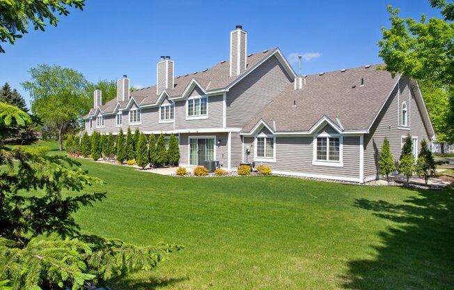 a large house with a lawn in front of it