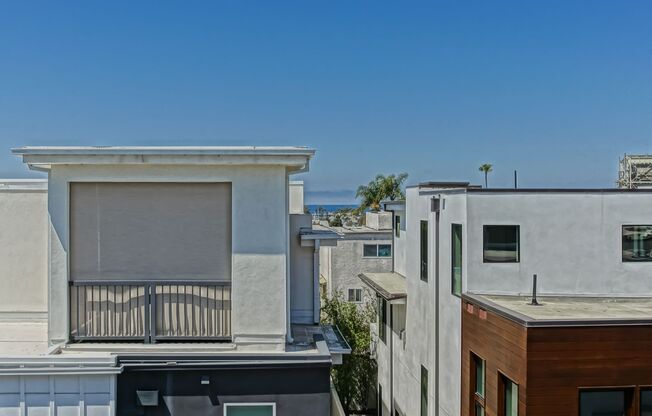 Custom, Modern & Spacious Tri-Level Home w/ Amazing Great Room Living Space, 4 Balconies/Decks, Ocean Views & 2-Car Garage Close to Schools, Restaurants, Shopping & Just 4 Blocks to Beach!