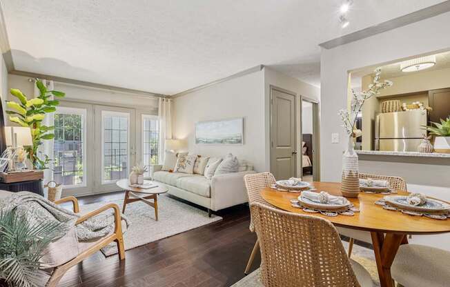 A dining room with a wooden table set for six.