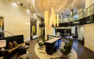 Lobby of Citron with white lights and green chairs.