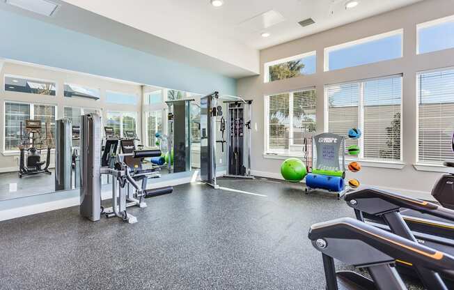 the gym at the enclave at woodbridge apartments in sugar land, tx