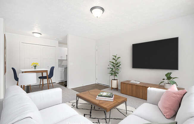 A modern living room with a white couch, a wooden coffee table, and a TV at Old Farm Apartments, Elkhart, Indiana