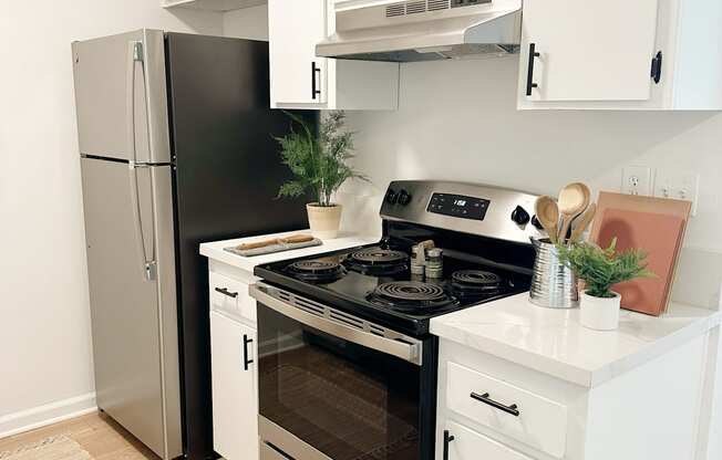 kitchen with white cabinets and stainless steel appliances at Mission Valley, San Diego, 92120