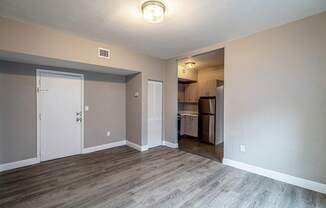 Wood-style flooring in select living spaces - Helios Apartments Miami Beach