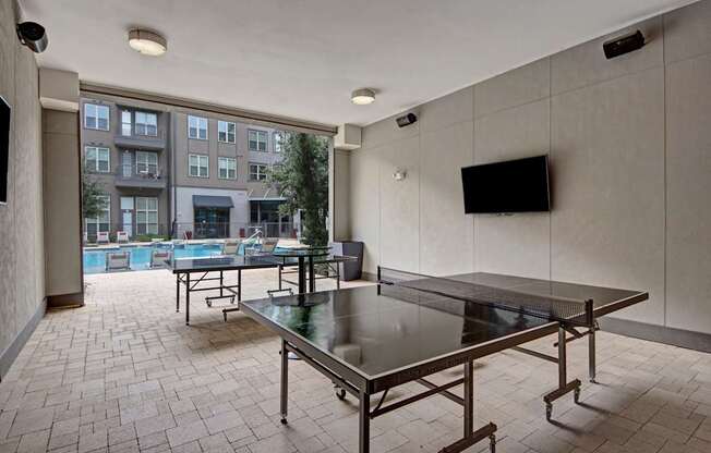 Poolside Outdoor Yard Game Area at Civic at Frisco Square Apartments, Frisco