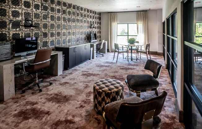 a living room with a couch and chairs and a table
