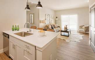 an open floor plan with a kitchen and living room at 44 West Luxury Living, Valley Park, MO