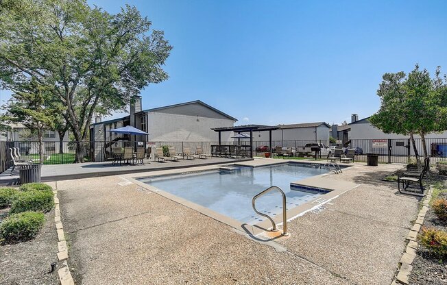 the reserve at bucklin hill pool and hot tub with buildings in the background