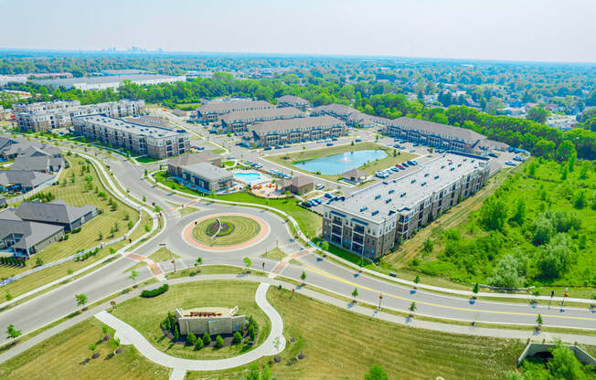 an aerial view of a city with roads and buildings