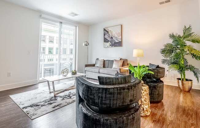 a living room with a couch and a round table