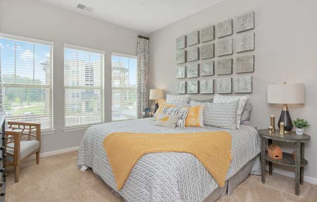 bedroom with yellow blanket at Residence at Riverwatch, Agusta, GA