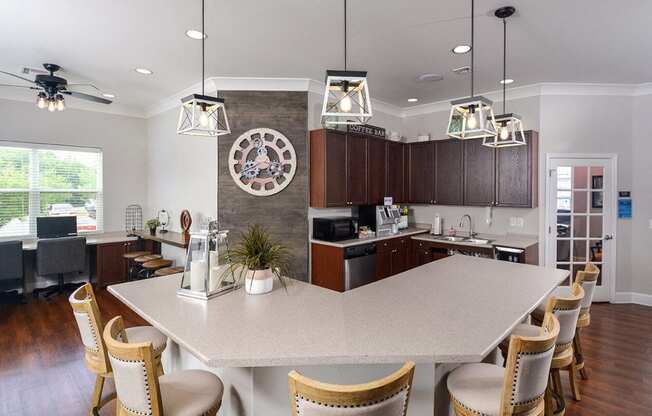 a kitchen with a large island and a clock on the wall