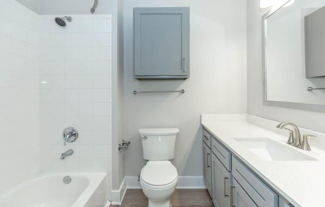 a room with a sink and a mirror