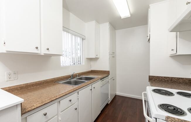 Kitchen with White Appliances and White Cabinets