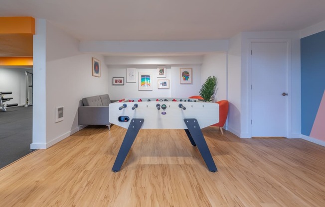 a games room with a foosball table