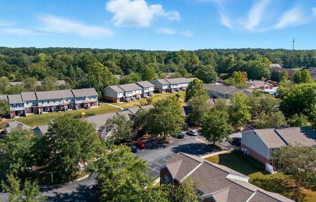 A bird's eye view of a residential area with houses and trees.