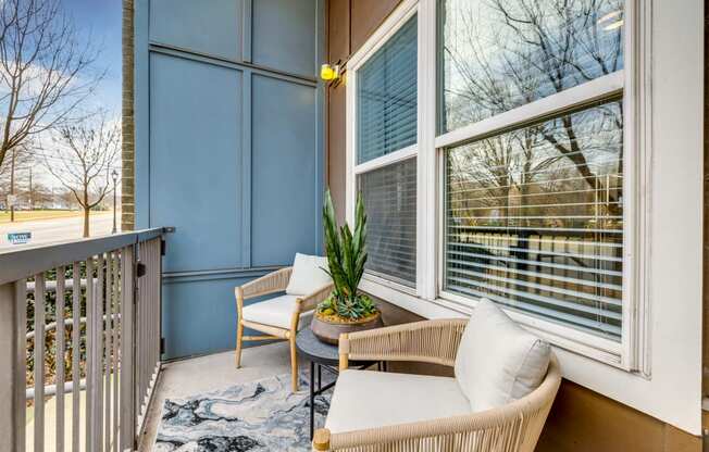 A private balcony with stylish furniture offered at Midtown 205, luxury partments, Charlotte, NC.