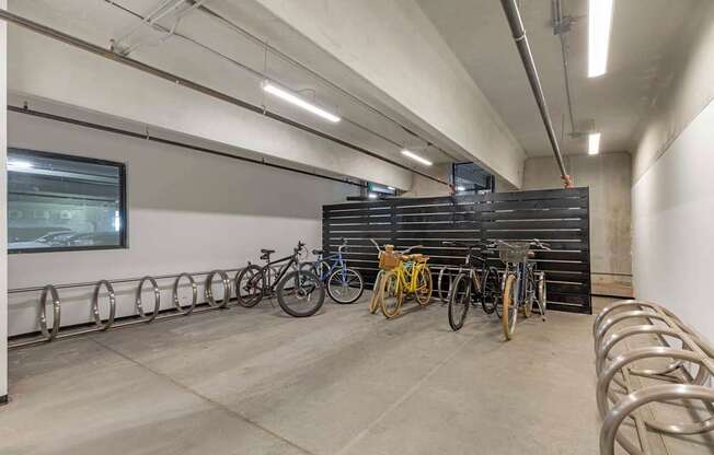 A bike parking area with bicycles parked in metal racks.
