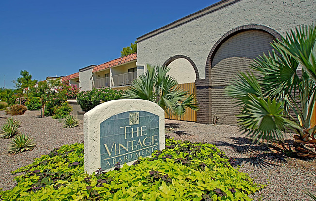 an image of the vineage apartments sign in front of the building