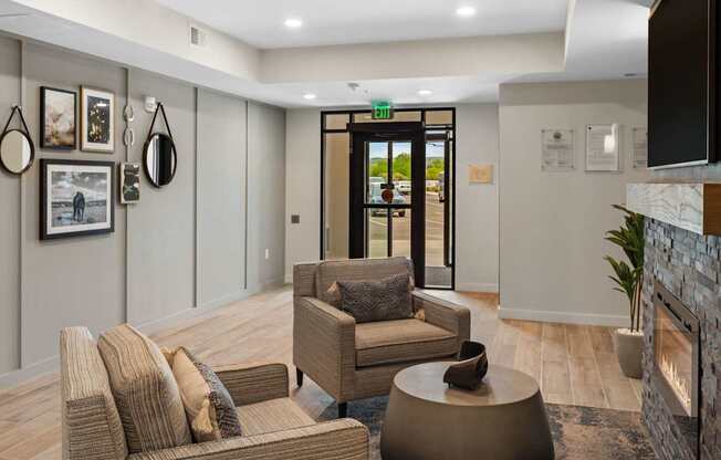 A living room with a brown couch, a chair, and a coffee table.