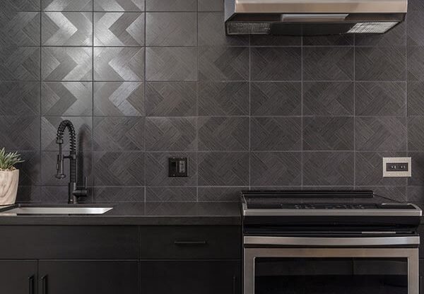 a kitchen with a stove top oven next to a sink