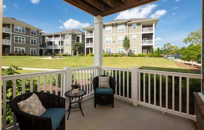 Balcony sitting area at Abberly Market Point Apartment Homes, Greenville