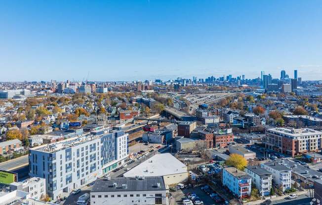 A cityscape with buildings and a clear sky.