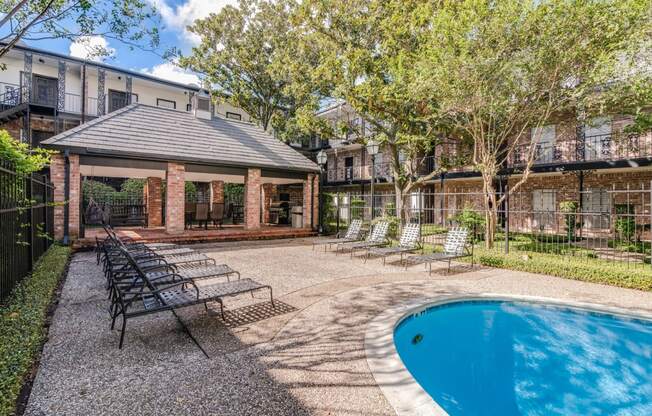 Barbecue Area and Sundeck by Pool at Allen House Apartments, Houston, TX