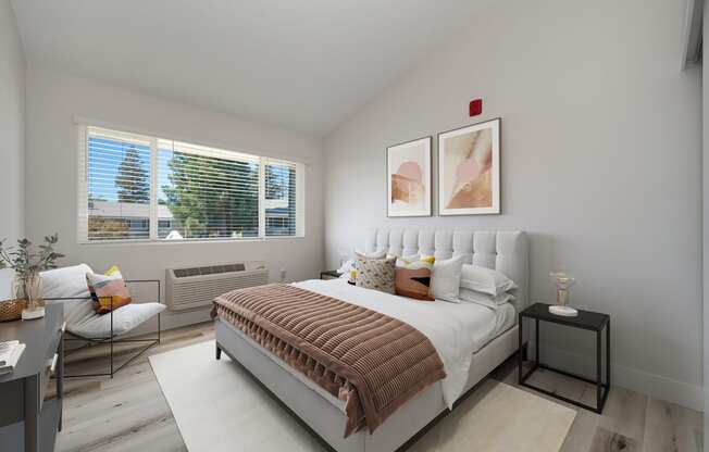 a bedroom with a bed and two windows at Track 281 Apartments, Sacramento, CA, 95811