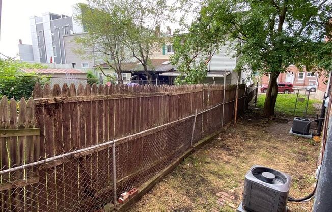 Updated 2BR Row Home in Lawrenceville – Central Air, Pets Welcome, Private Yard & Basement!