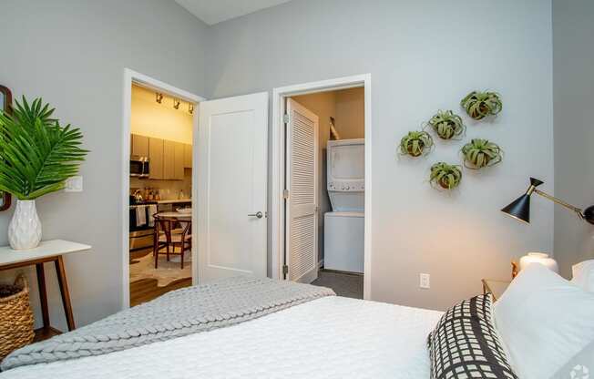 This is an alternate view of the master bedroom with the washer and dryer in the closet at Grand Flats, St. Louis, 63104