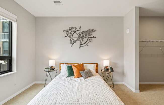 a bedroom with a bed and a wall art above it at EagleRidge Plaza Residences, Fargo