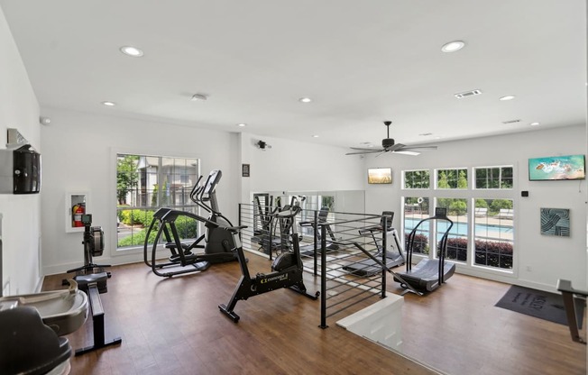 A spacious gym with a variety of exercise equipment.