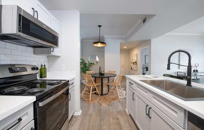 a kitchen and dining area in a 555 waverly unit