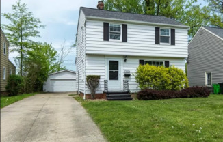 A Fantastic Colonial Home within a Park Like Setting!