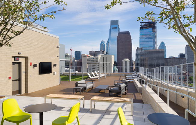 Our rooftop deck features plenty of outdoor seating, a flat screen TV, and breathtaking views of the Philly skyline