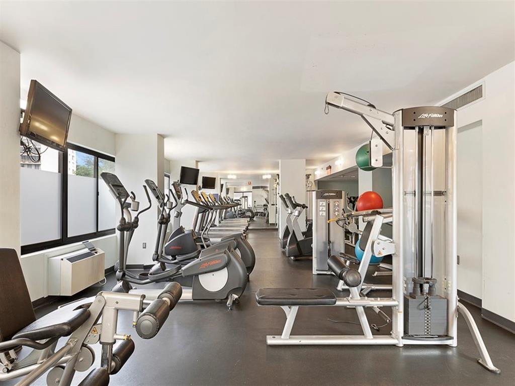 Steppers, treadmills, and weight machines inside the Prospect Place fitness center in Hackensack, NJ