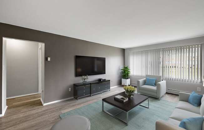 a living room with a couch and a coffee table and a television