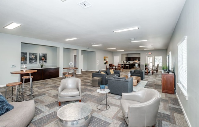 a common area with couches chairs and tables