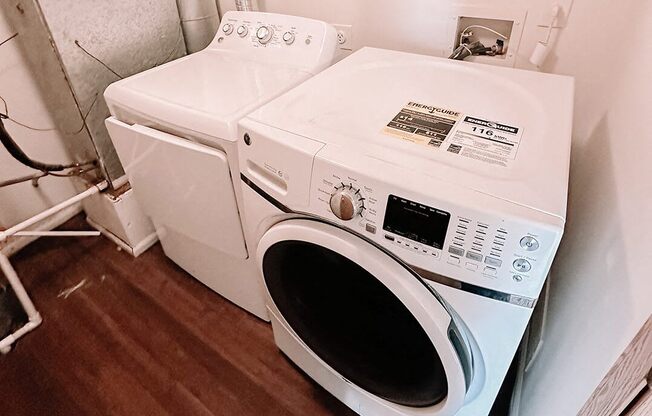 a washing machine and a dryer in a room