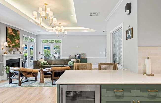 A modern kitchen with a stainless steel oven and a dining table with chairs.