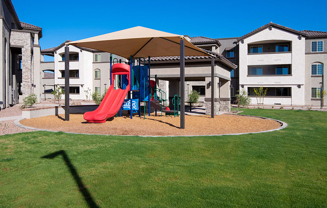 a playground at the enclave at woodbridge apartments in sugar land, tx