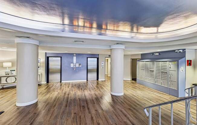 A modern interior with a curved ceiling and wooden floors.