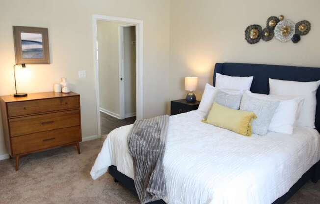 View of the bedroom in the model home at Harbour Breeze Apartments in Suffolk Virginia