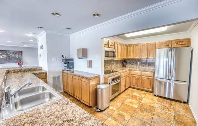 a large kitchen with a round ceiling and wood cabinets